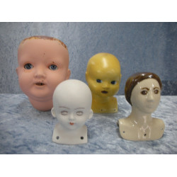 4 various doll heads